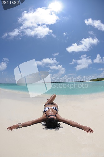 Image of beautiful young woman  on beach have fun and relax