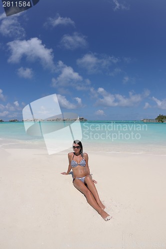 Image of beautiful young woman  on beach have fun and relax