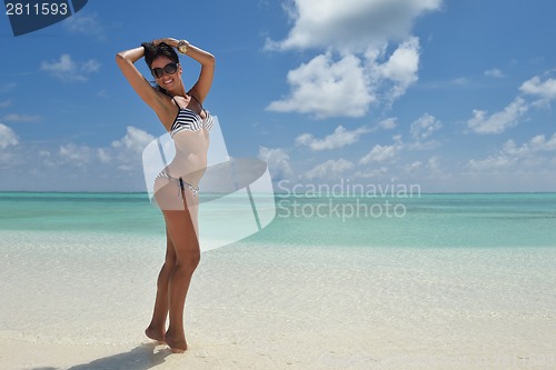 Image of beautiful young woman  on beach have fun and relax