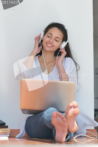 Image of relaxed young woman at home