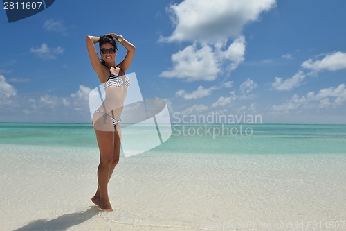 Image of beautiful young woman  on beach have fun and relax