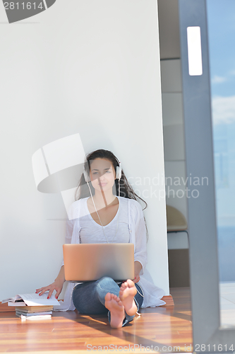 Image of relaxed young woman at home