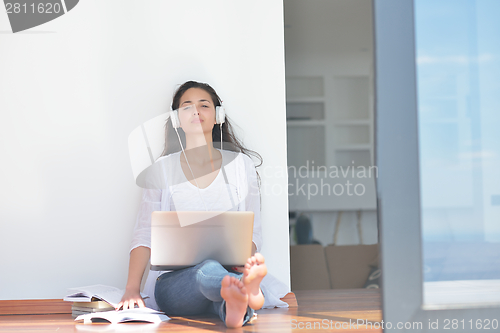 Image of relaxed young woman at home