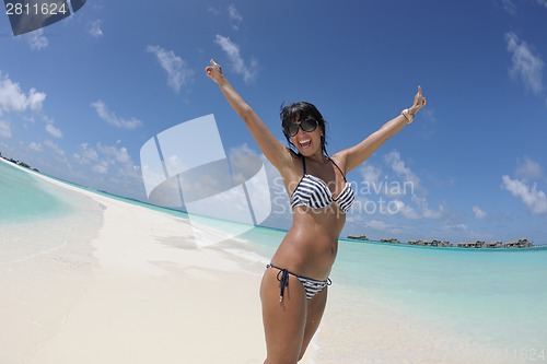 Image of beautiful young woman  on beach have fun and relax