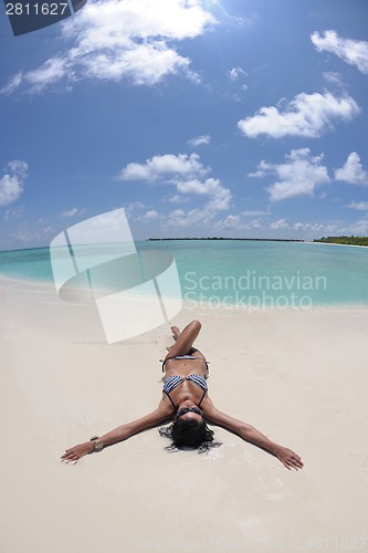 Image of beautiful young woman  on beach have fun and relax