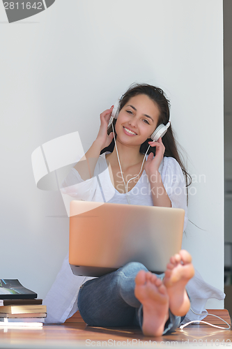 Image of relaxed young woman at home