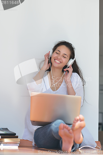 Image of relaxed young woman at home