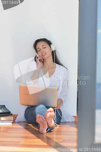 Image of relaxed young woman at home