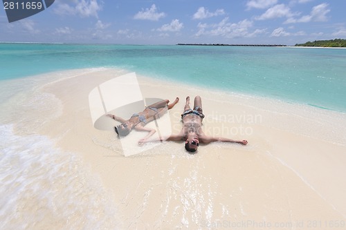 Image of happy young couple have fun on beach