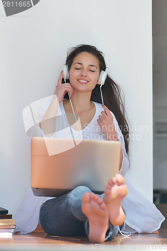 Image of relaxed young woman at home