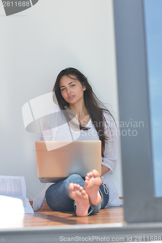 Image of relaxed young woman at home