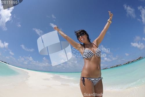 Image of beautiful young woman  on beach have fun and relax