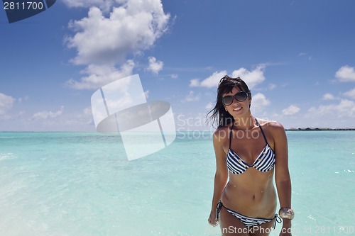 Image of beautiful young woman  on beach have fun and relax
