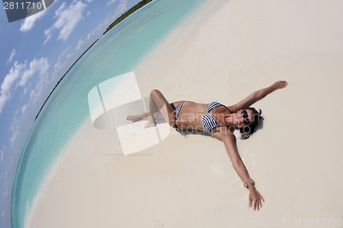 Image of beautiful young woman  on beach have fun and relax