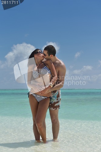 Image of happy young couple have fun on beach