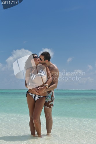Image of happy young couple have fun on beach