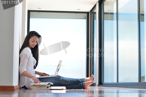 Image of relaxed young woman at home