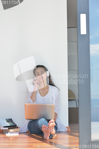 Image of relaxed young woman at home