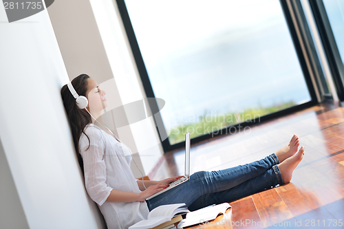 Image of relaxed young woman at home