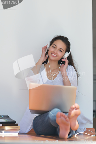 Image of relaxed young woman at home