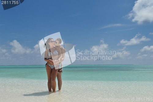 Image of happy young couple have fun on beach