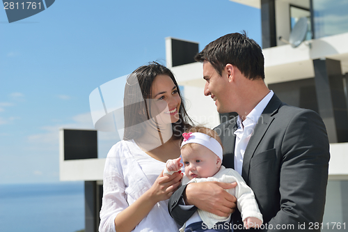 Image of happy young family at home