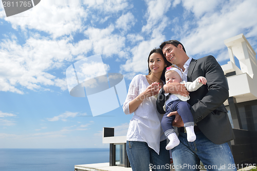 Image of happy young family at home