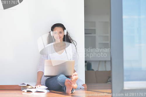 Image of relaxed young woman at home