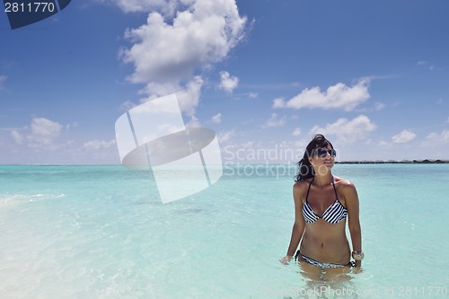 Image of beautiful young woman  on beach have fun and relax