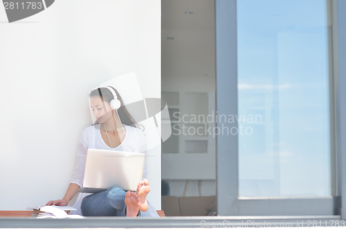 Image of relaxed young woman at home