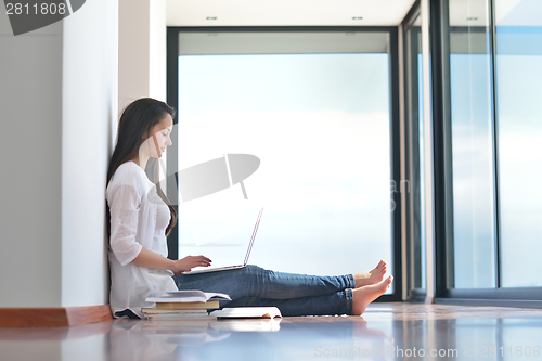 Image of relaxed young woman at home