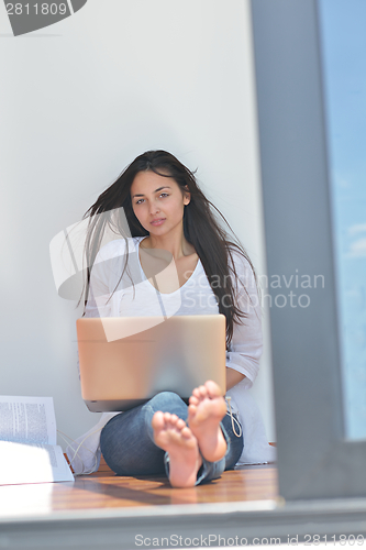 Image of relaxed young woman at home