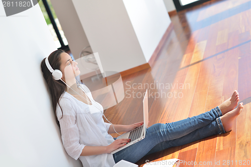 Image of relaxed young woman at home