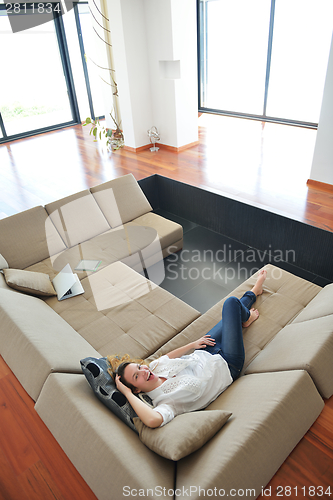 Image of couple at home using tablet computer