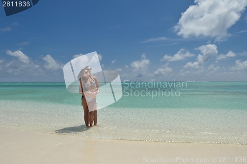 Image of happy young couple have fun on beach
