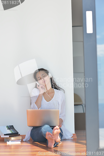 Image of relaxed young woman at home