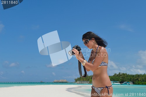 Image of beautiful young woman  on beach have fun and relax