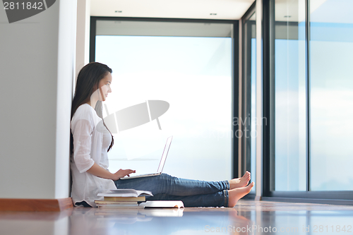 Image of relaxed young woman at home