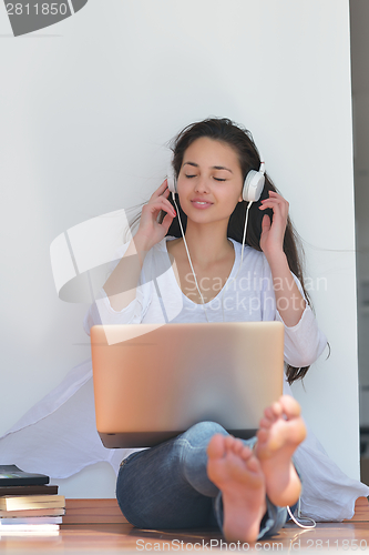 Image of relaxed young woman at home