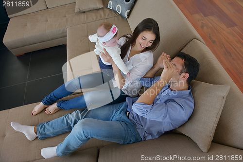 Image of happy young family at home