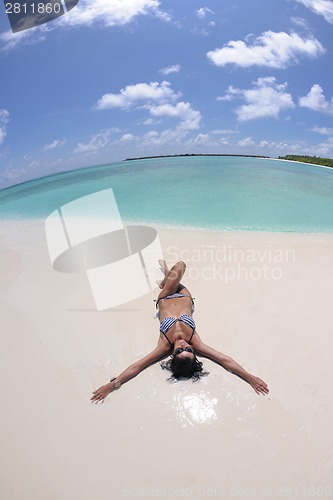 Image of happy young couple have fun on beach