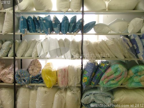 Image of wall of pillows and other bed supplies