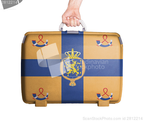 Image of Used plastic suitcase with stains and scratches