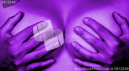 Image of Hands covering breasts