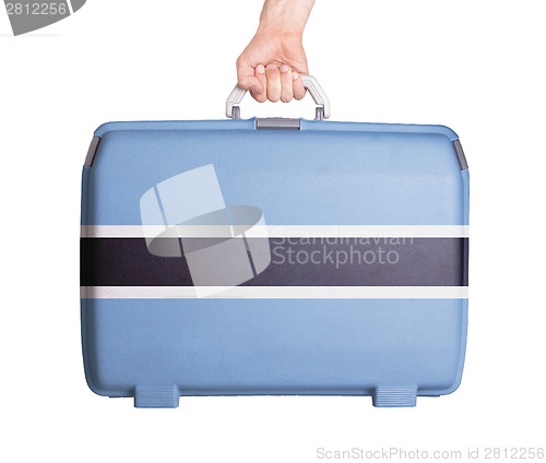 Image of Used plastic suitcase with stains and scratches