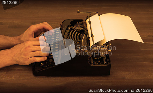 Image of Writer or reporter behind the typewriter