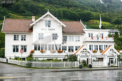 Image of Old white wooden hotel in Utne, Norway