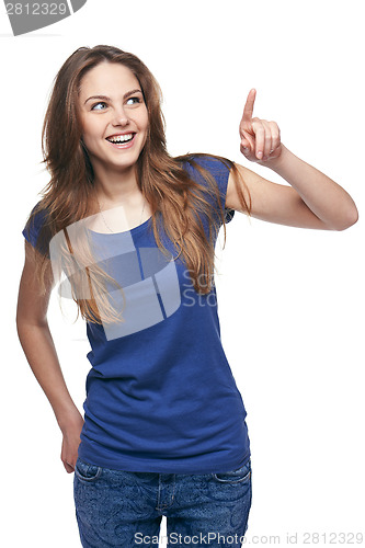 Image of Smiling emotional girl pointing to the side