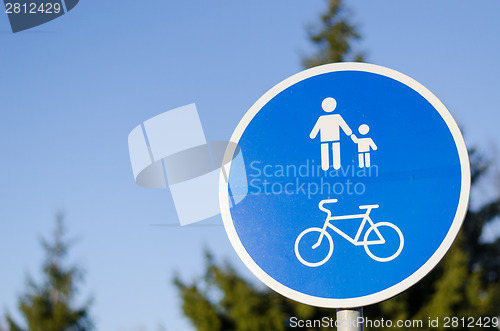 Image of bicycle and pedestrian lane road sign in blue 