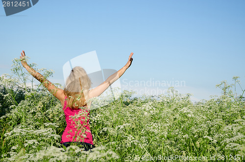 Image of girl put hands to sky tall caraway grass summer 